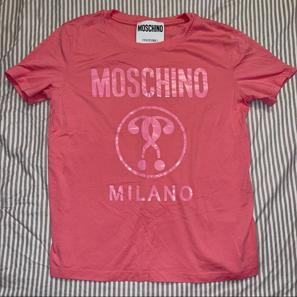 Authentic moschino t shirt, light stain on the N, barely noticeable.